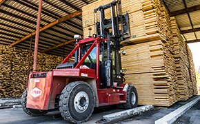 Taylor pneumatic tire forklift hauling lumber