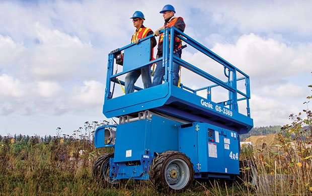 Workers on a Genie scissor lift