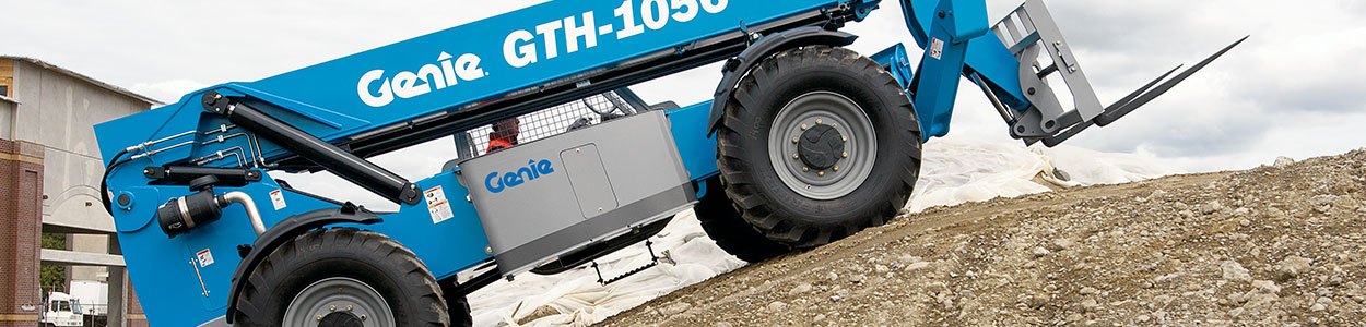 Genie telehandler driving up a hill