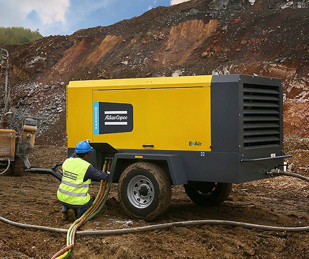 Towable air compressor used on a construction site