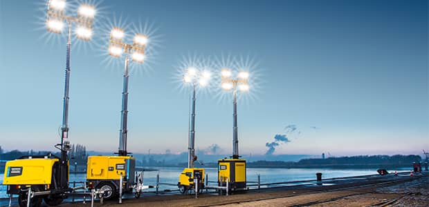 Light towers working at night with replaced parts