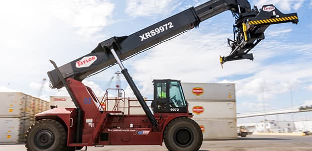 Taylor reach stacker with new parts working with containers