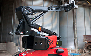 Manitou articulating boom lift working on a building