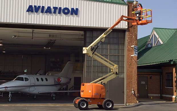 Rental of an articulating boom lift working on a building