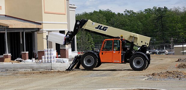 Rental of a telehandlers zoom boom working on a construction site