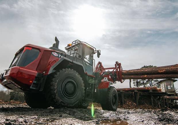 Taylor wheel loader rental working with lumber