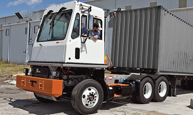 Rental of a yard spotter backing up to a warehouse