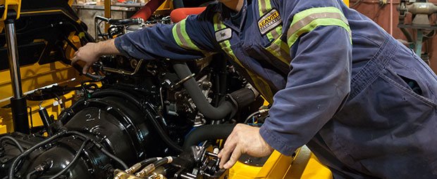 In-Shop Technician repairing a forklift