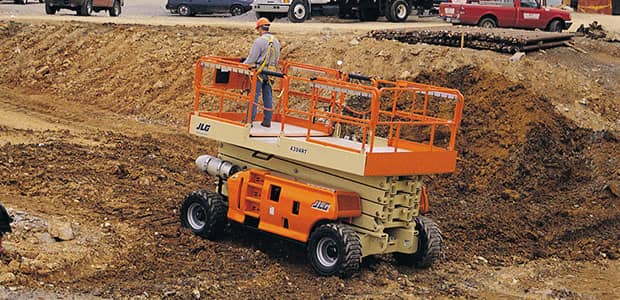 Serviced scissor lift working at a construction site