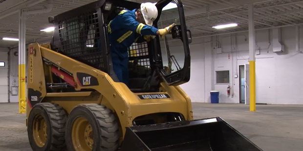 Skid steer training on a CAT skid steer