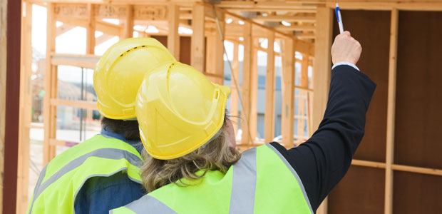 Two construction workers doing hazard assessment training