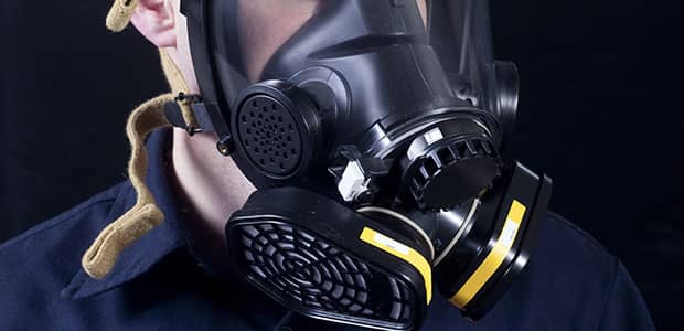 Worker wearing respirator protective equipment