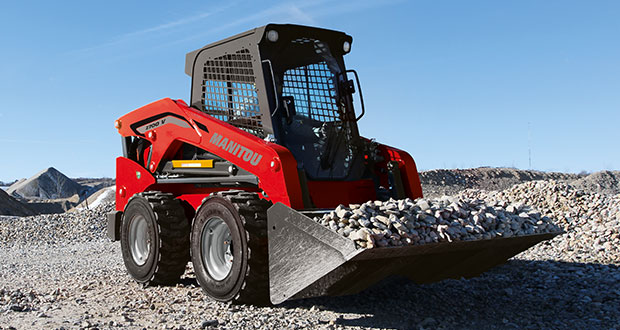 Working doing skid steer training in a yard