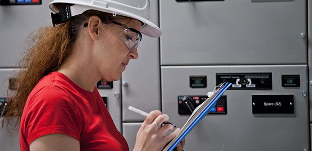 Electrical worker with a checklist