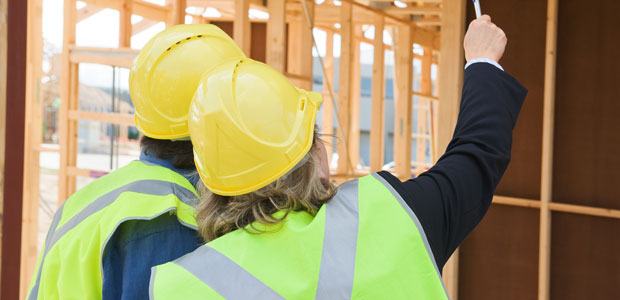 Contractors looking at a construction site