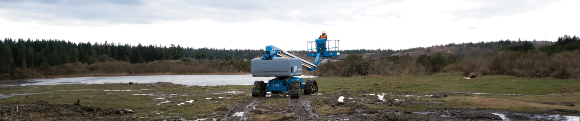 Worker practicing mobile elevated work platform safety on a worksite