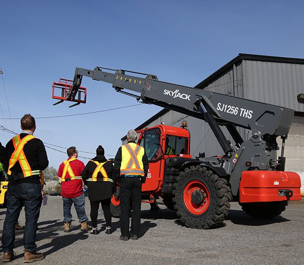 Operator training class outside on a skyjack telehandler