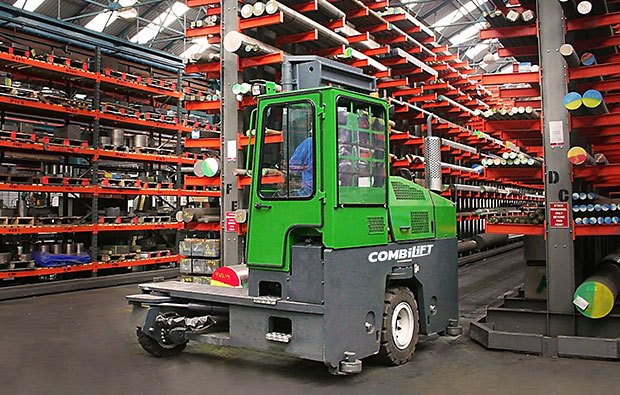 Worker trained on a Combilift forklift operating it in a warehouse