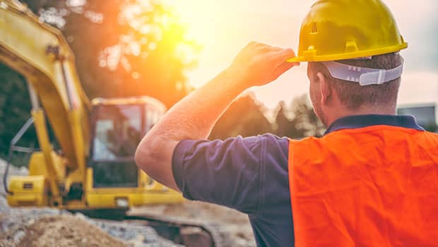 Worker doing excavator operator training for a certification