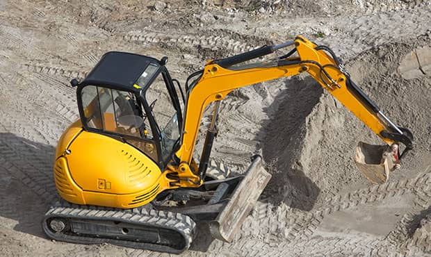 Safety training for a excavator at a construction site