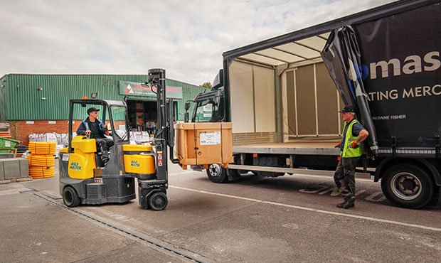 Operator trained on a narrow aisle forklift loading a truck