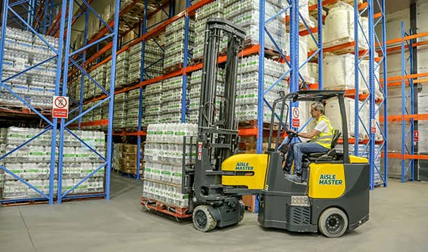 An operator that is trained on narrow aisle forklifts working in a warehouse