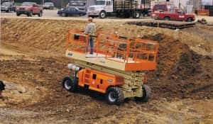 An operator completing a Scissor Lift Training course practical exam outside