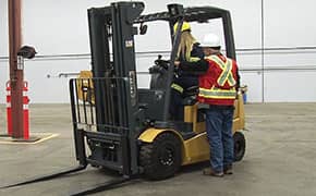 Leavitt Machinery trainer working with an forklift operator